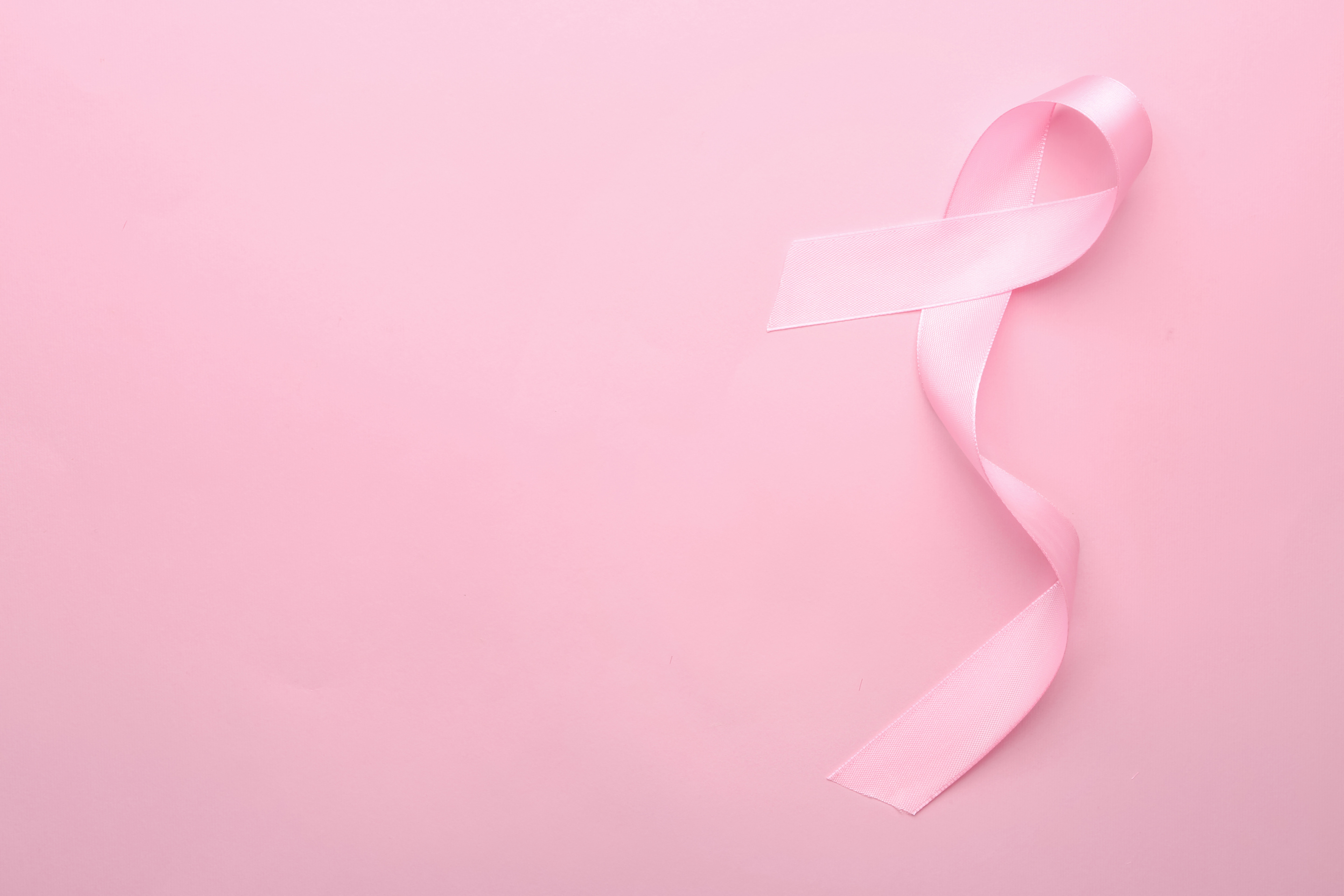 Pink Ribbon on Color Background. Breast Cancer Concept